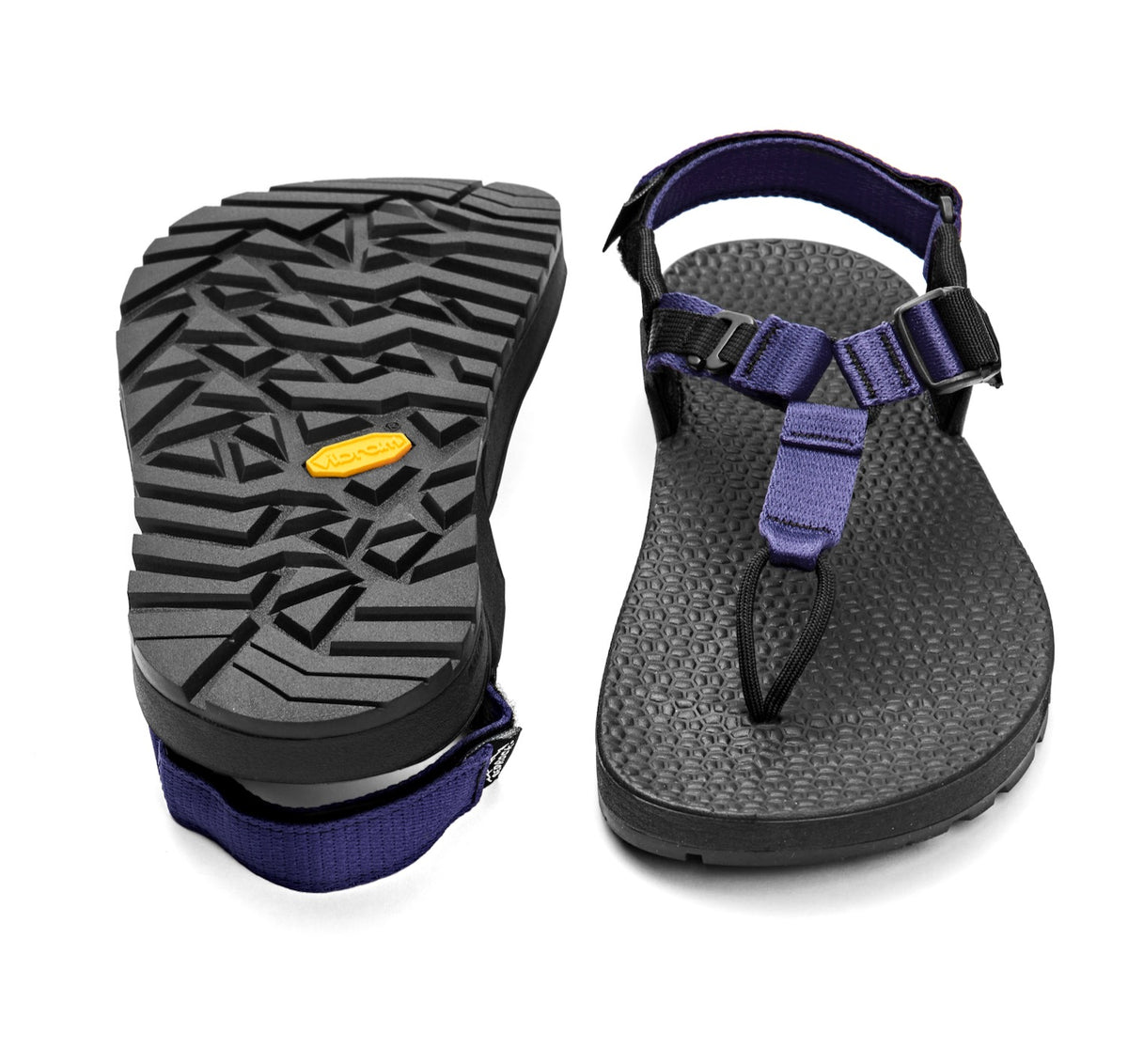 A pair of Cairn Evo 3D sandals with lupine purple straps and a rugged black vibram Evo XS Trek sole.