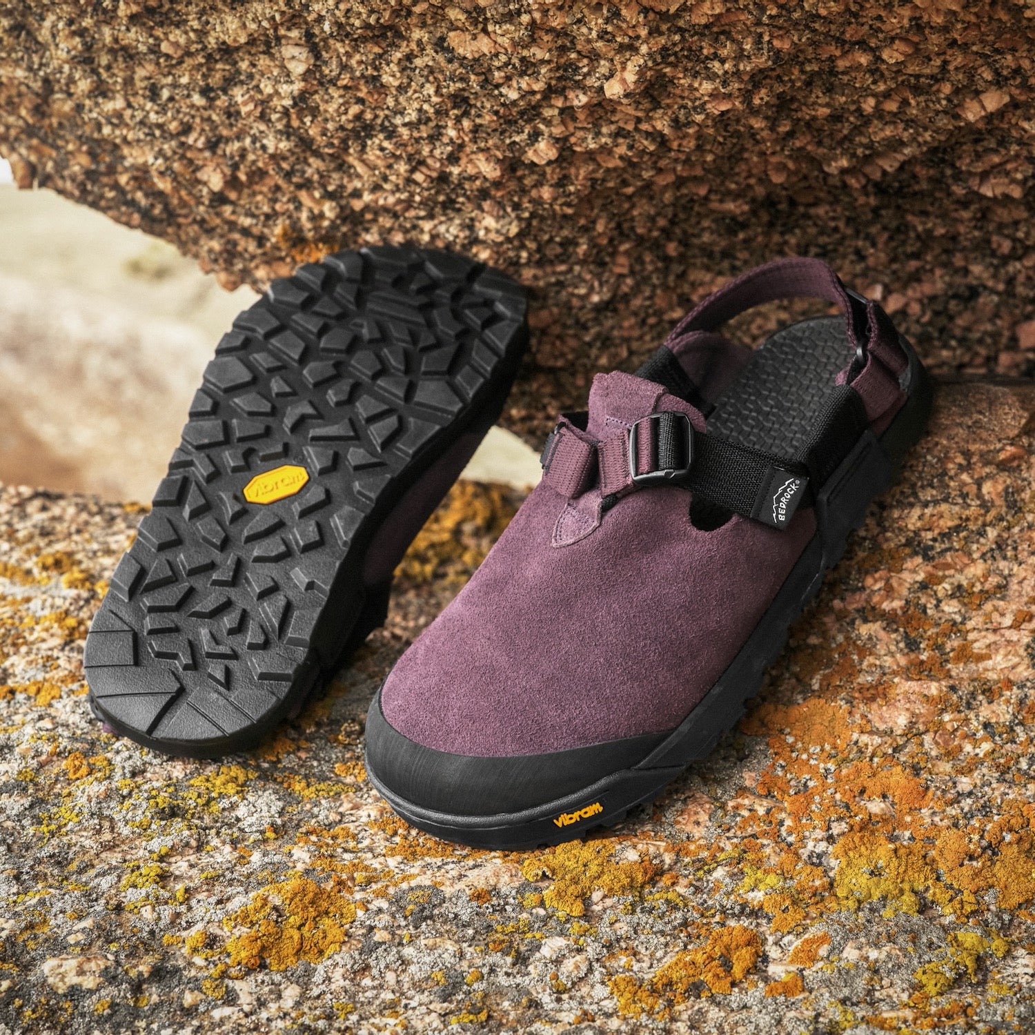 Mountain Clog along rock in deep plum leather suede