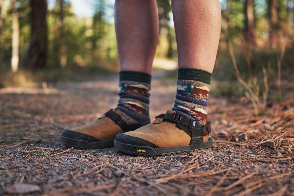 Person standing on a trail in Leather Mountain Clogs