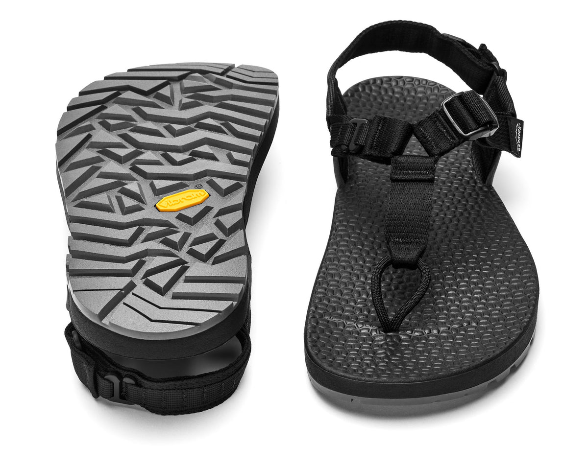 A pair of Cairn Evo 3D PRO sandals with black straps, featuring a gray rugged Megagrip vibram sole.