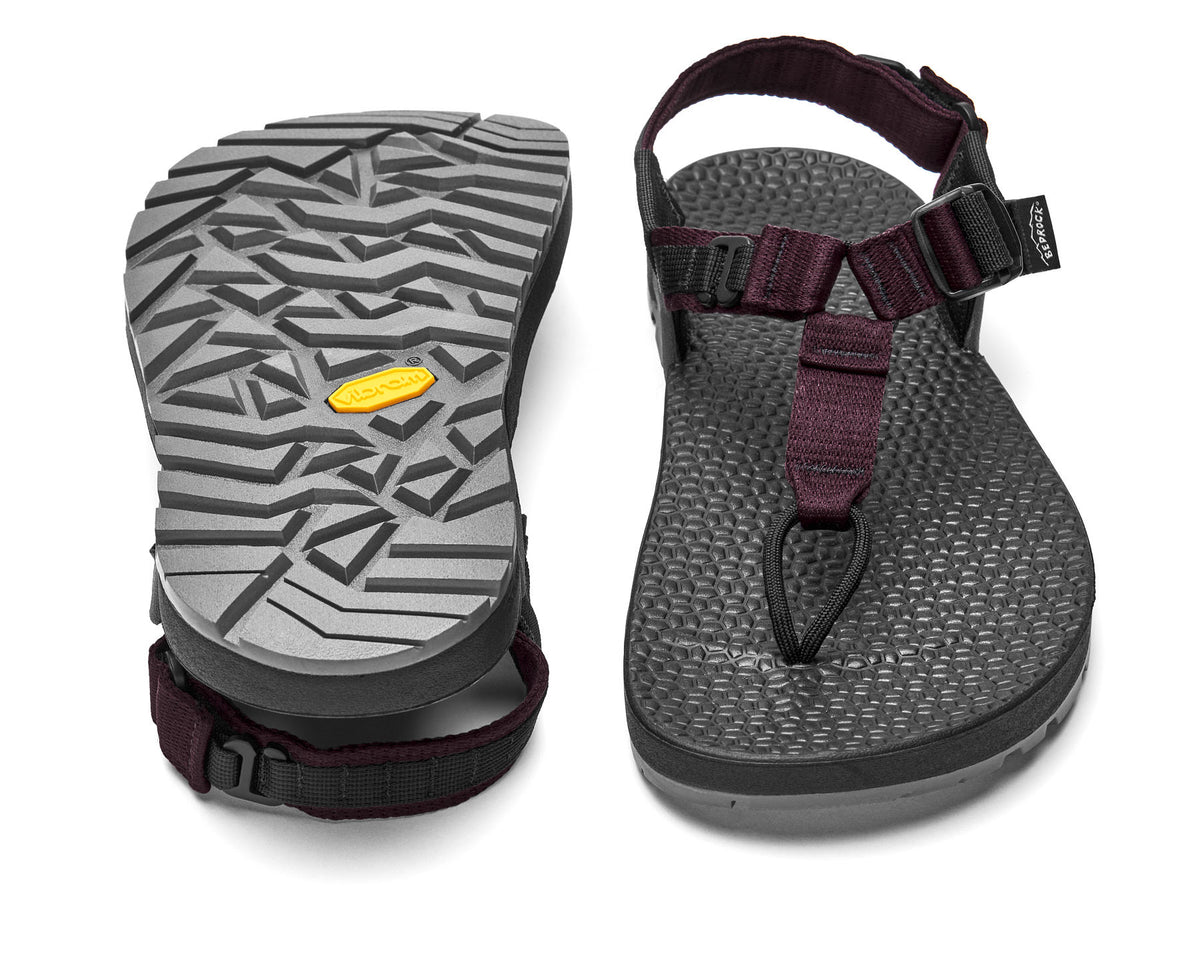 A pair of Cairn Evo 3D PRO sandals with burgundy straps, featuring a gray rugged Megagrip vibram sole.