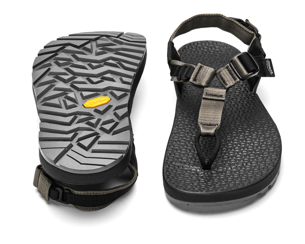 A pair of Cairn Evo 3D PRO sandals with charcoal straps, featuring a gray rugged Megagrip vibram sole.