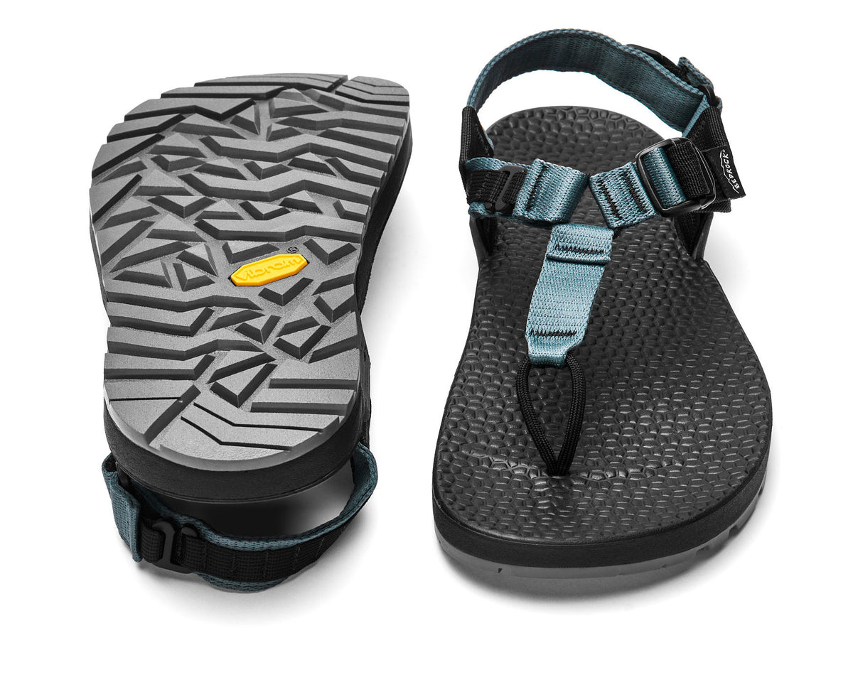 A pair of Cairn Evo 3D PRO sandals with slate blue straps, featuring a gray rugged Megagrip vibram sole.