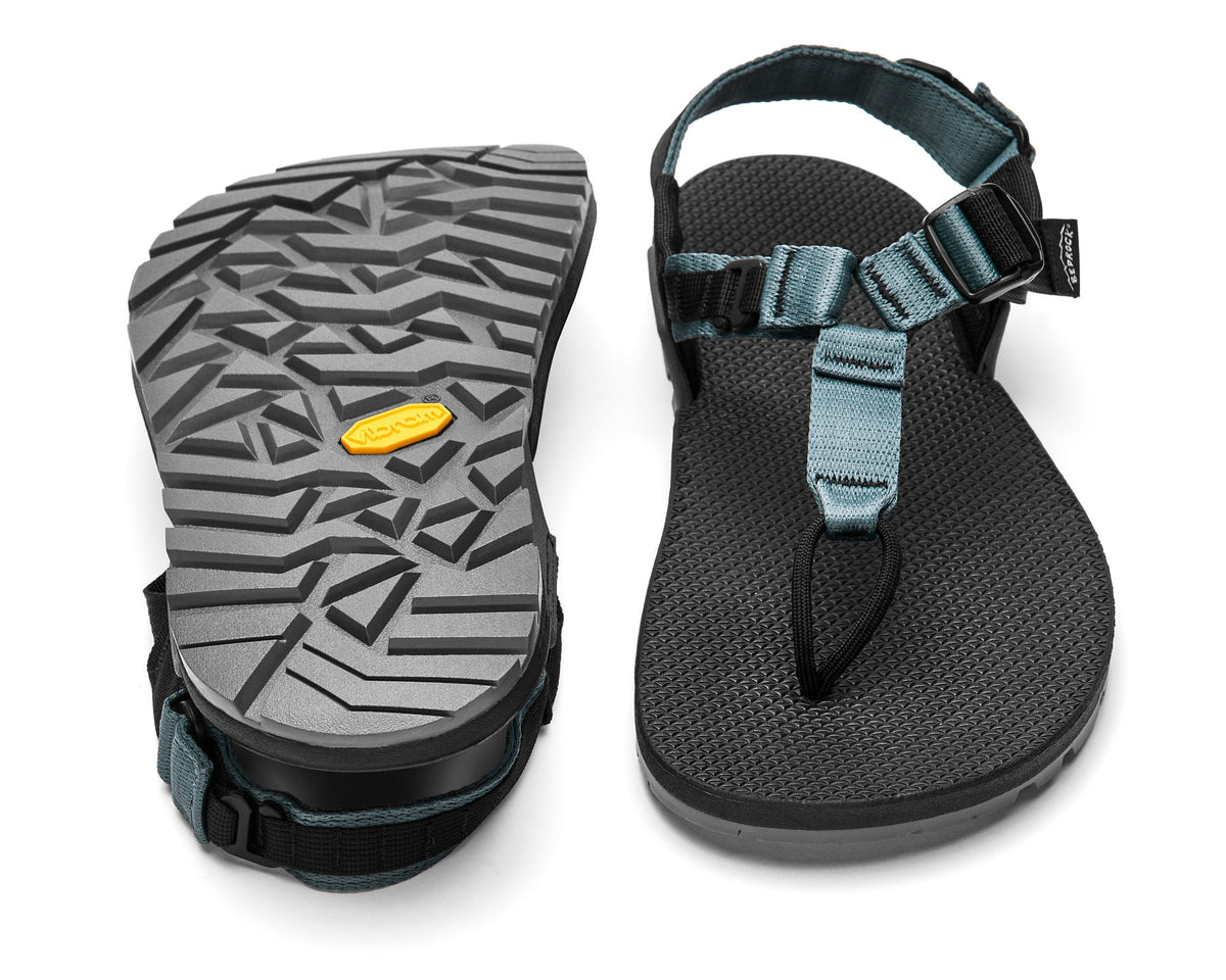 A pair of Cairn Evo PRO Sandals with skate blue straps and black footbed, featuring a hook-and-loop strap design and Vibram Megarip outsole.