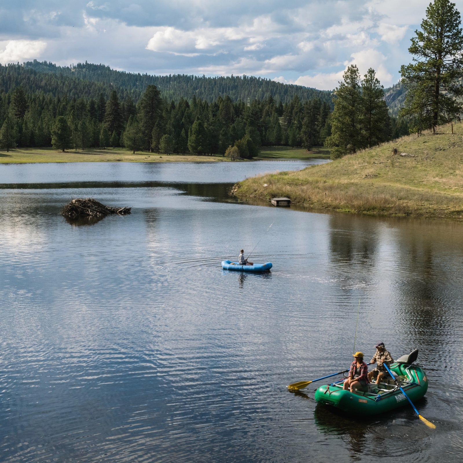Two boats paddling in a Montana lake