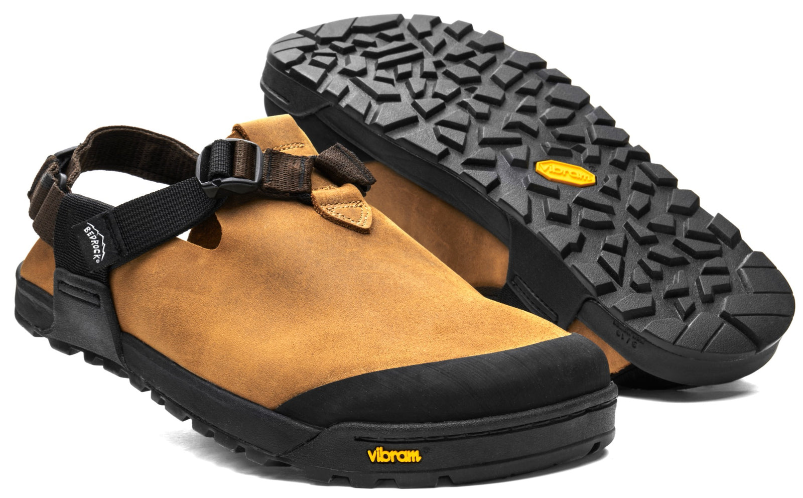 A pair of Brown Nubuck Leather Mountain Clogs displaying a rugged vibram outsole and upper.