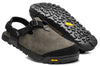 A pair of driftwood gray Nubuck leather mountain clogs with an adjustable strap and a thick, rugged black sole.