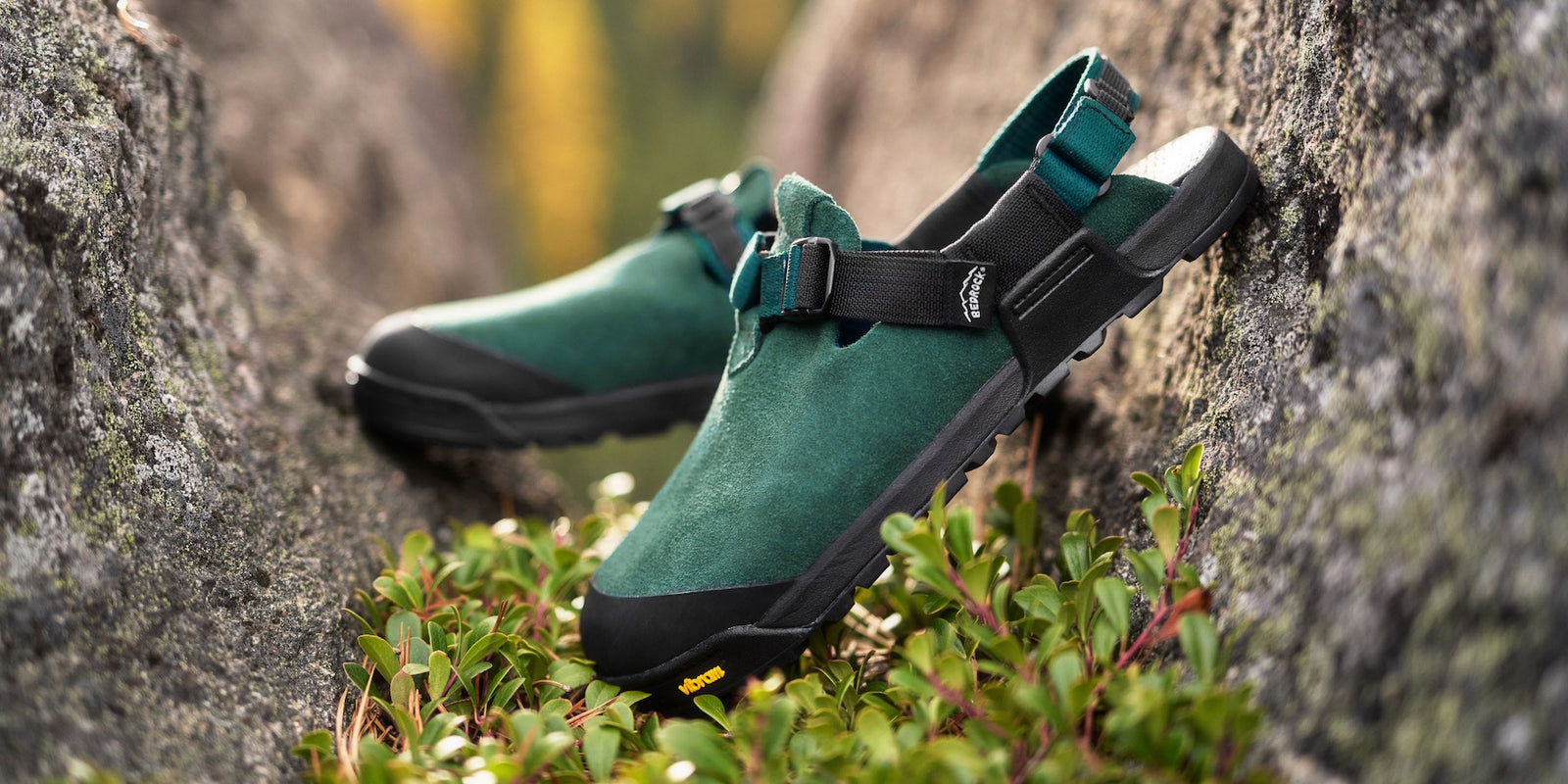 Green mountain clogs  on a rocky surface