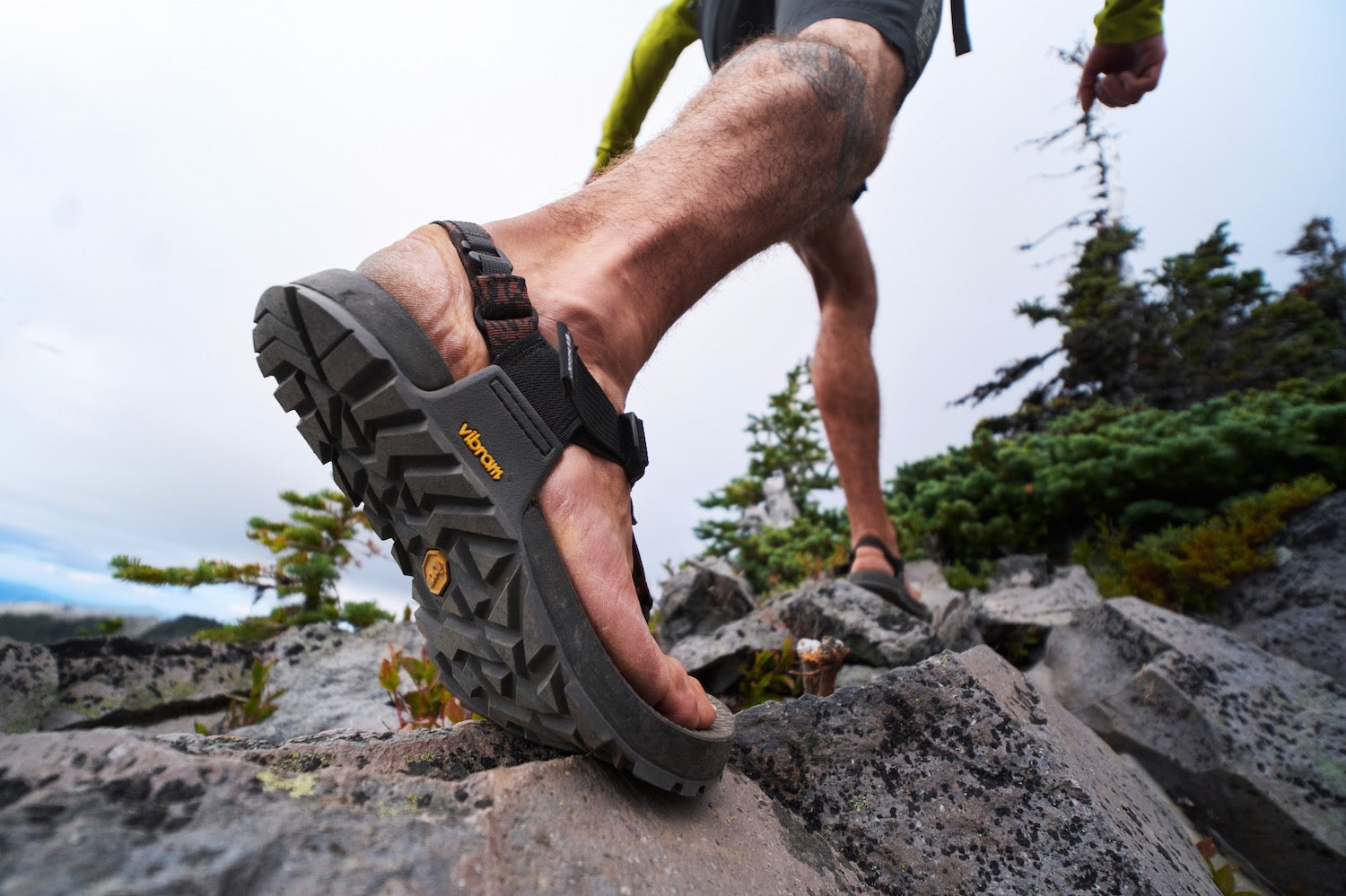Person wearing Bedrock Sandals hiking