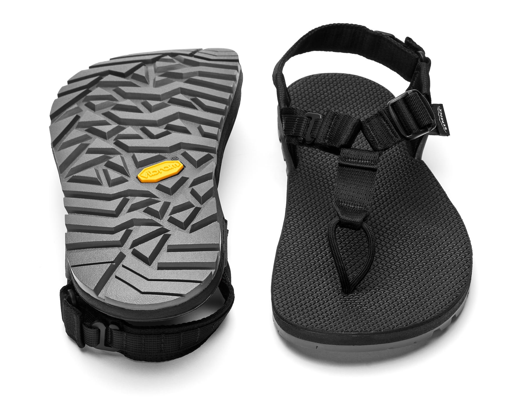 A pair of Cairn Evo PRO Sandals with black straps and black footbed, featuring a hook-and-loop strap design and Vibram Megarip outsole.