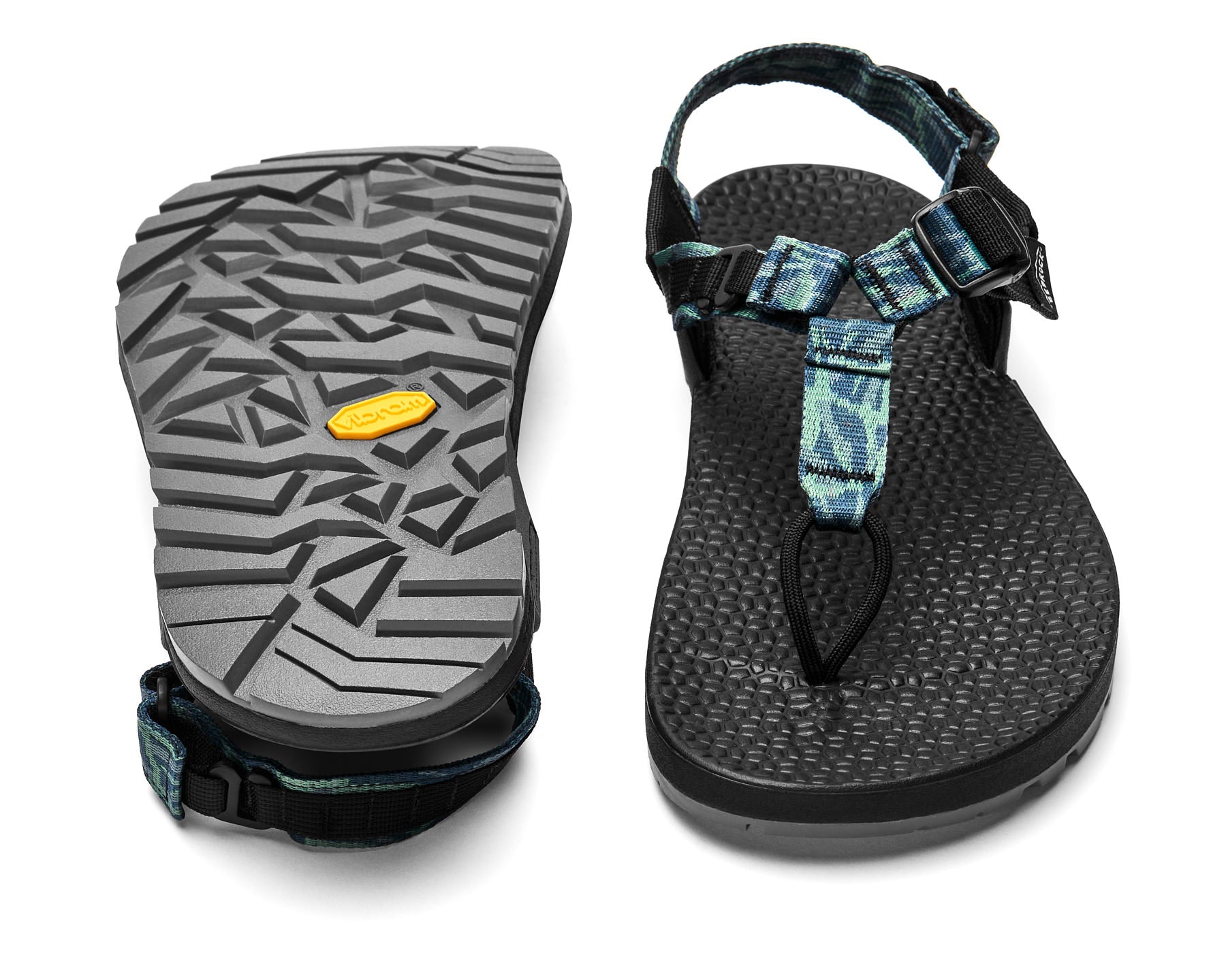 A pair of Cairn Evo 3D PRO sandals with blue pattern straps, featuring a gray rugged Megagrip vibram sole.
