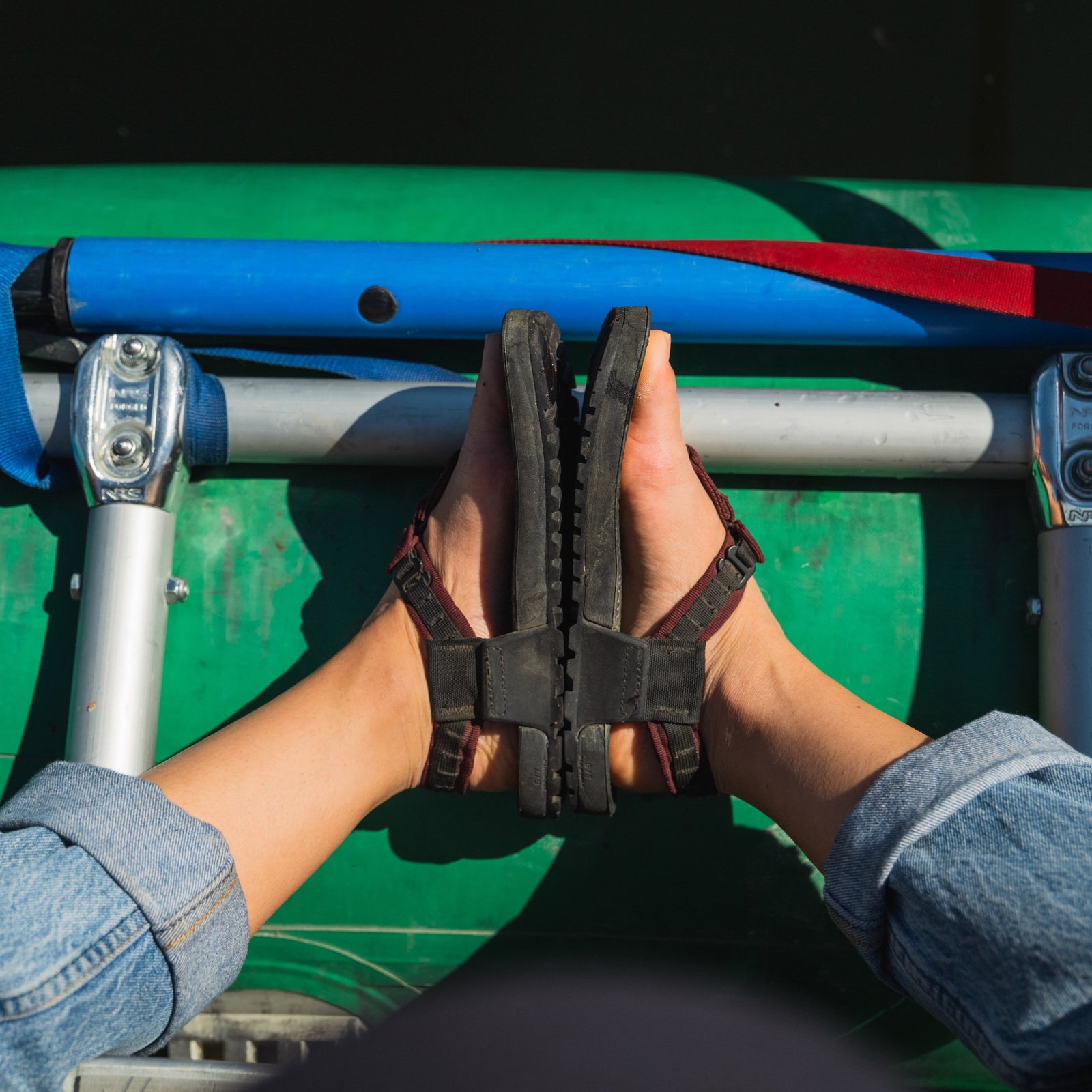 POV of Bedrock Cairn 3D sandals on a whitewater raft