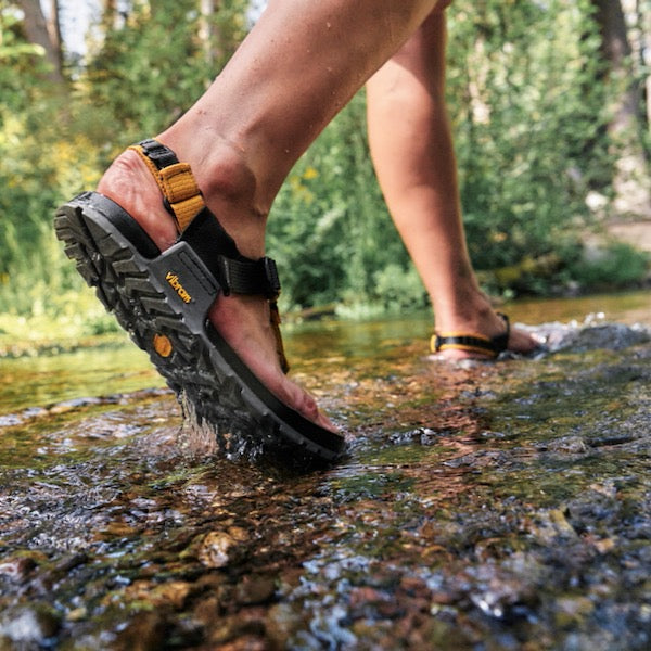 Walking through stream in Bedrock Sandals