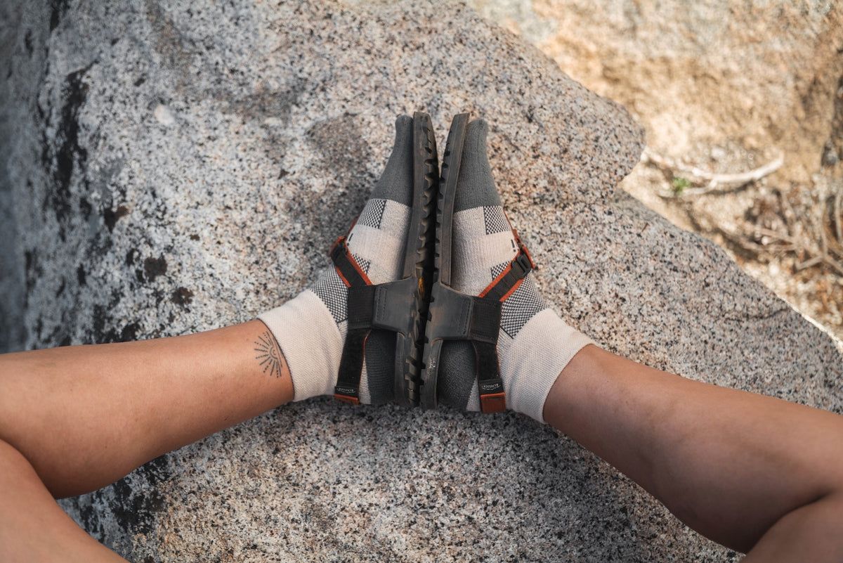Person wearing Birch Split-Toe Bedrock Injinji Socks sitting point of view.