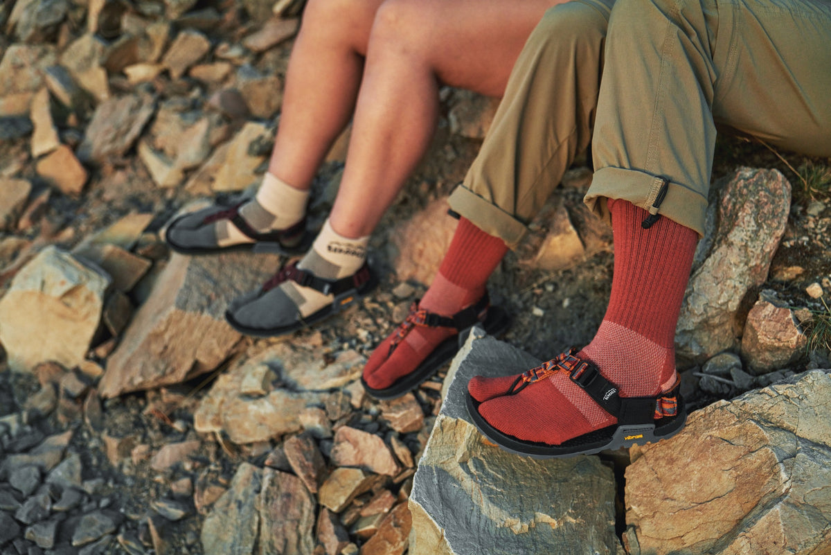 Bedrock split toe socks modeled in sandals outdoors